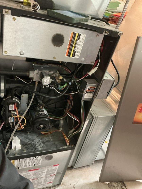 Completed comprehensive Gold AC inspection on 10+ year old residential air conditioning and furnace system. Performed thorough examination of indoor air handler unit located in basement, inspecting blower assembly, motor operation, electrical connections, refrigerant lines, and condensate drain system. Evaluated outdoor condensing unit including fan operation, coil condition, and overall system performance. All components found to be operational at time of inspection. Documented system condition with photographs for maintenance records. Advised homeowner that maintenance plan has expired and requires renewal for continued seasonal coverage, with furnace inspection due from previous plan period.