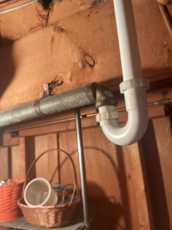 Completed plumbing repair quote for kitchen sink drainage system and associated basement plumbing connections. Assessed existing white PVC trap configuration, garbage disposal installation, flexible supply lines, and basement plumbing infrastructure including galvanized metal piping and vertical PVC drainage system. Customer approved quoted repair work estimated at 2-3 hours for completion.