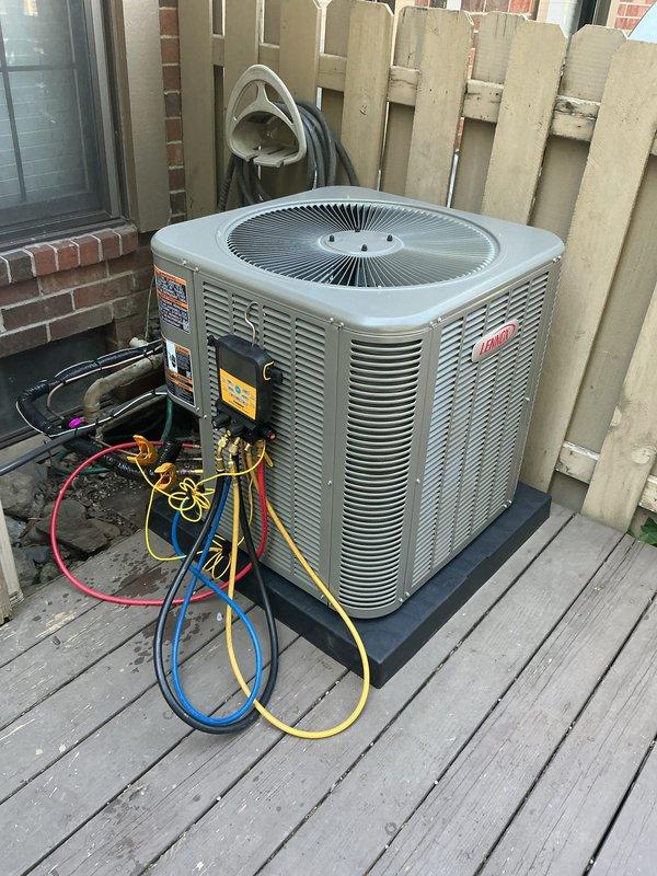 Successfully installed a 2.5-ton Lennox air conditioning condenser unit with matching evaporator coil at rear of property. Unit was positioned on rubber pad on existing wooden deck, refrigerant lines were connected and charged, electrical reconnection completed, and system was tested and verified operational with all manufacturer specifications met.