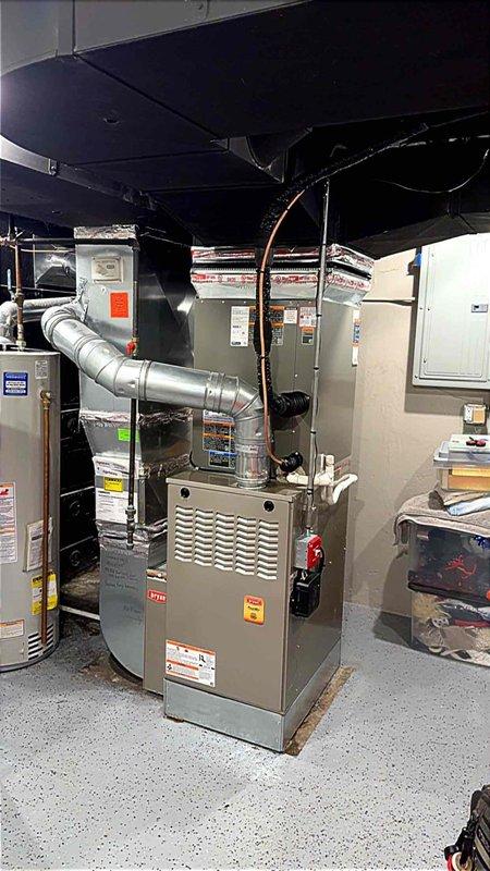 Completed installation of 3.5 ton air conditioning system with matching evaporator coil in residential basement mechanical room. Connected refrigerant lines, installed flexible ductwork to existing furnace plenum, verified electrical connections, and reconnected humidifier to new system. All mechanical, electrical, and HVAC permits were obtained prior to installation, and system was tested for proper operation upon completion.