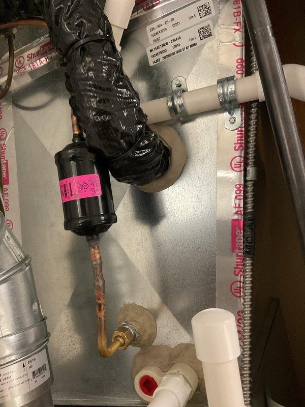 Completed comprehensive GOLD AC inspection on basement coil system installed two years ago. Thoroughly examined evaporator coil, refrigerant lines, electrical connections, and all system components; documented equipment condition with photographs showing proper installation and operational status. All components found to be functioning within normal parameters with no immediate service needs identified.