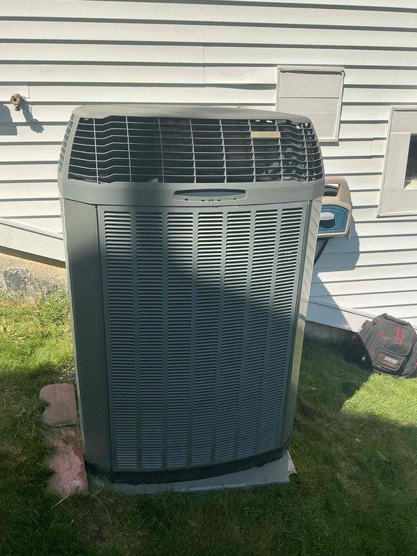 Completed comprehensive Gold-level preventive maintenance inspection on a 14-year-old Trane residential air conditioning system. Unit showed no reported operational issues prior to service. Performed thorough visual examination of outdoor condenser unit, confirming proper installation on concrete pad with adequate clearance and airflow. Inspected electrical connections, refrigerant lines, and condensate drainage components. Verified all safety labels and manufacturer specifications remained legible and intact. Unit appeared to be in normal operating condition consistent with age, with typical outdoor weathering on metal casing. Documented equipment condition through photographic records. System is scheduled for next maintenance in 2026.