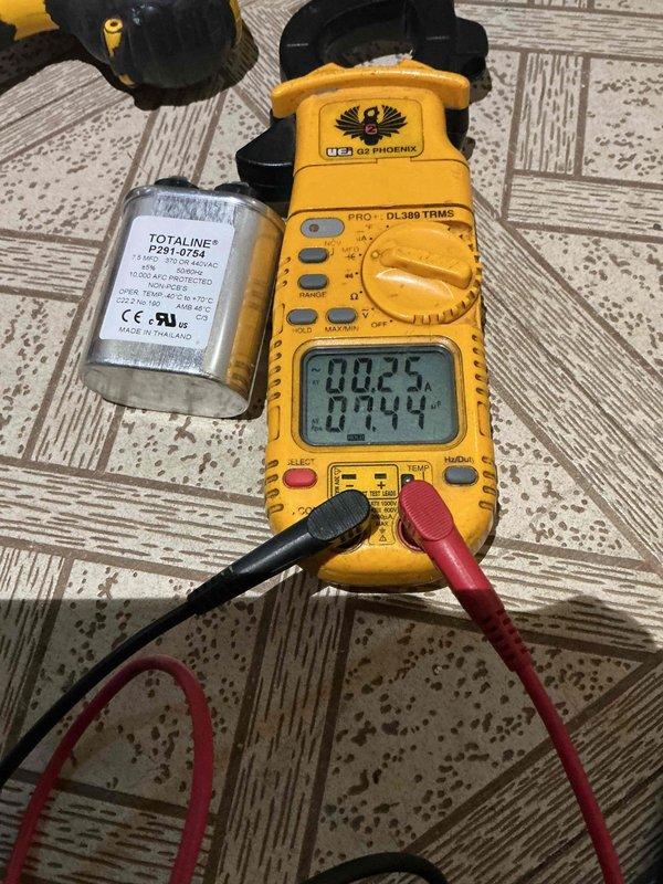 Responded to callback for water leak issue on 10+ year old AC system located in basement. Upon arrival after 3 PM, inspected air handler and condensate drainage system where water accumulation had been reported on top of furnace. Used digital multimeter to perform electrical diagnostics and verify system operation. Tested capacitor functionality to ensure proper compressor and fan motor operation. Examined ductwork connections and air handler cabinet for signs of condensation or drain line blockage. Photographed HVAC installation including ductwork configuration and electrical components for documentation purposes. Addressed water leakage concern and cleared system for operation after completing diagnostics and necessary repairs to condensate management system.