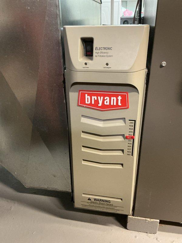 Completed comprehensive Gold AC inspection on residential Bryant HVAC system less than one year old with air handler located in basement. Performed multi-point inspection including verification of system operation, visual examination of furnace cabinet, electronic high-efficiency air filtration system, ductwork connections, and PVC condensate drainage lines. All equipment found to be functioning properly with no deficiencies noted at time of inspection.