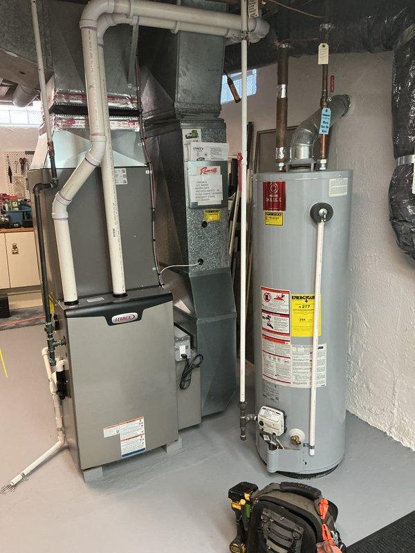 Completed comprehensive Gold AC inspection on residential Bryant HVAC system less than one year old with air handler located in basement. Performed multi-point inspection including verification of system operation, visual examination of furnace cabinet, electronic high-efficiency air filtration system, ductwork connections, and PVC condensate drainage lines. All equipment found to be functioning properly with no deficiencies noted at time of inspection.