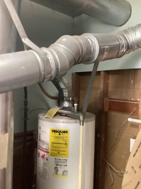 Completed HVAC estimate for replacement of 11-year-old air conditioning system with leaking evaporator coil located in basement. Customer declined repair option after previous diagnostic visit identified refrigerant leak requiring leak search, repair, and refrigerant recharge. Assessed existing system configuration including coil installation adjacent to water heater in mechanical room with flexible ductwork routing through basement structure. Provided comprehensive replacement estimate for new equipment installation to address failed component and restore cooling capacity to residence.