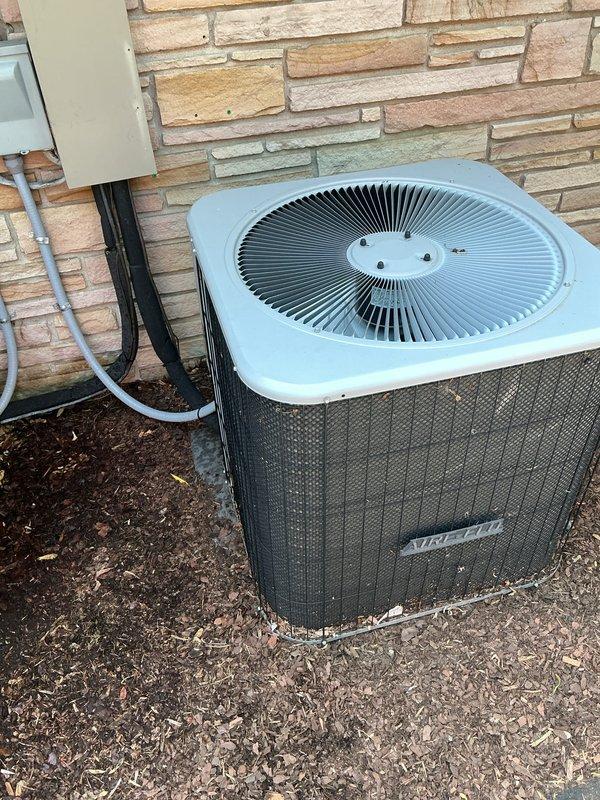 Completed comprehensive Gold AC inspection on two residential air conditioning systems, including an Aire-Flo condenser unit manufactured in 2016 with air handler located in basement. Performed full system evaluation including visual inspection of outdoor condensing units, verified operational status of both systems, examined refrigerant lines and electrical connections, and assessed overall equipment condition. Both outdoor units were found to be in good working condition with clean casings and proper installation on concrete pads. Advised customer that the area surrounding condensers should be kept clear of debris and animal waste to maintain optimal system performance and prevent potential airflow restrictions or component damage.