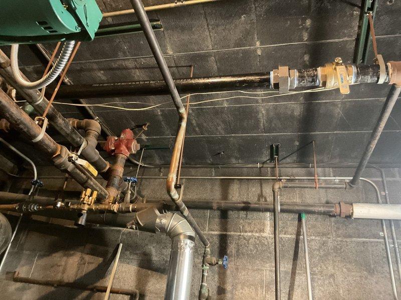 Performed gas line pressure test on commercial plumbing system utilizing 2" IP ball valve. Inspected mechanical room piping infrastructure including copper gas lines, valves, and associated fittings to verify system integrity and proper pressure retention. All components tested and documented per code requirements.