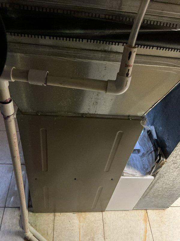 Provided estimate for complete HVAC system replacement on residential unit over 25 years old experiencing operational issues. Assessment included evaluation of outdoor condenser unit mounted at exterior brick wall near electrical meter and indoor air handler system located on tiled floor in mechanical space with existing PVC drainage and ductwork connections.