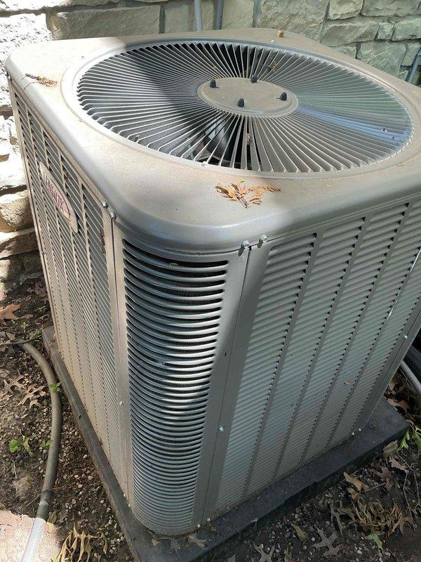 Completed NSP AC inspection on 2-year-old system for city compliance requirements. Performed comprehensive evaluation of outdoor condenser unit, noting surface rust and corrosion on top panel near fan grille with minor debris accumulation, though unit remains structurally sound and operational. Accessed crawl space to inspect evaporator coil and refrigerant system components, including sight glass and line set connections, confirming proper refrigerant charge and system integrity. All inspection findings documented with photographic evidence for city records.