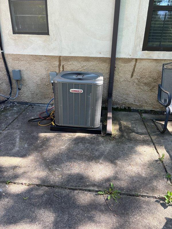 Completed full HVAC system installation including a 90,000 BTU furnace and 2.5-ton Lennox air conditioning unit with rear discharge configuration. Installed Aprilaire humidifier integrated into the ductwork system with proper water supply connections via PVC piping. Mounted outdoor condenser on concrete pad with electrical disconnect, ran refrigerant lines, and installed new thermostat for system control. All mechanical and electrical permits obtained prior to installation, and system was fully tested and operational upon completion.