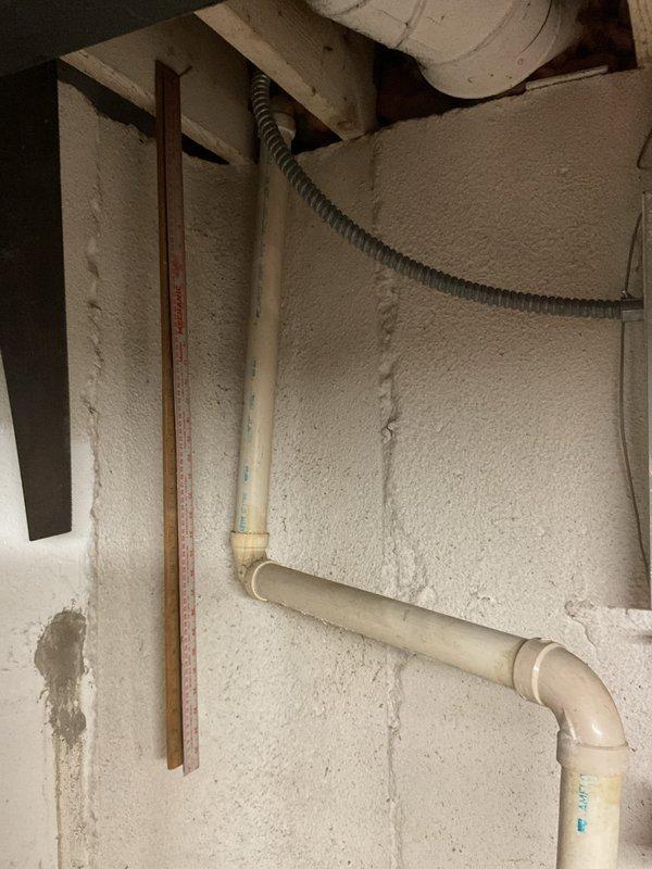 Responded to water leak complaint involving sump pump discharge line and slow-draining toilet. Inspected exterior PVC sump pump discharge assembly mounted on brick wall foundation and identified leaking connections at pipe joints. Replaced faulty fittings, check valve, and damaged PVC sections to eliminate water leakage at exterior discharge point. Verified interior sump pump operation and confirmed proper drainage flow through new piping assembly. Addressed slow toilet issue and completed system testing to ensure all plumbing functions restored to normal operation.