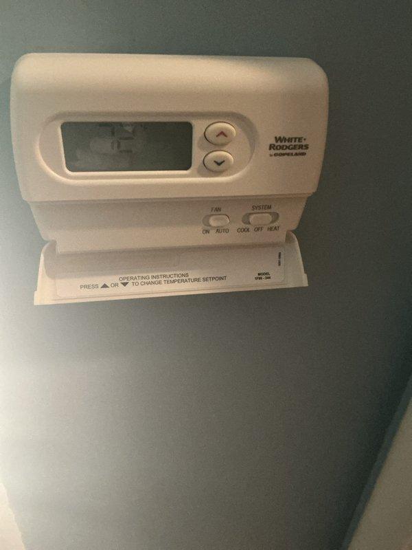 Responded to no-cooling call for 10+ year old air conditioning system being activated for first season following recent furnace installation in February. Upon inspection, found thermostat properly set to cooling mode at 75°F setpoint. Examined outdoor condensing unit and indoor evaporator coil circuit board, which showed signs of age with dust accumulation and minor corrosion on mounting surfaces. Verified thermostat wiring connections at both wall unit and control board terminal block, confirmed proper voltage supply, and tested system operation. Unit successfully started and began cooling cycle after addressing low-voltage control circuit issue.