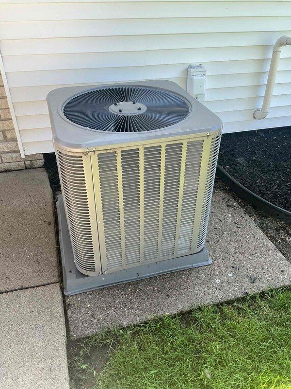 Completed prepaid HVAC maintenance visit on a 2-year-old residential cooling system with air handler located in basement. Performed comprehensive inspection of outdoor condenser unit and verified proper operation of all equipment. Unit found in good working condition with no immediate service needs identified. Documentation photos captured for maintenance records.