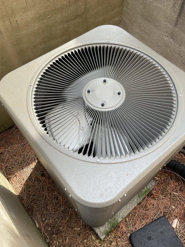 # HVAC Maintenance - Gold AC Inspection

Completed comprehensive Gold AC inspection on 6-year-old residential cooling system with air handler located in basement. Performed thorough evaluation of both indoor and outdoor equipment components per maintenance protocol.

Inspected outdoor condenser unit positioned on concrete pad against exterior wall. Verified fan assembly operation, examined casing integrity, and assessed overall unit condition. Condenser exhibited normal weathering consistent with age but maintained functional status with no structural damage to cabinet or fan grille.

Conducted detailed examination of basement air handler and associated mechanical components. Evaluated insulated ductwork, refrigerant line sets, and system connections. Documented significant corrosion and oxidation on copper refrigerant piping, showing deterioration with rust patches and discoloration ranging from dark brown to exposed copper. Corrosion noted at pipe joints and fittings, indicating pote