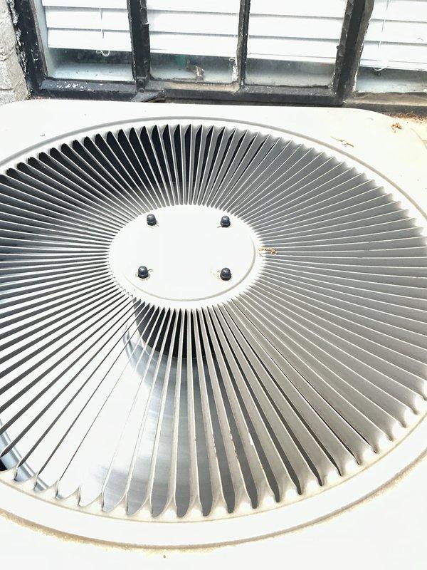 Completed comprehensive Gold AC inspection on 10+ year old air conditioning system with air handler located in basement. Performed thorough evaluation of outdoor condenser unit, inspecting fan assembly, blades, motor components, and housing condition. Verified proper operation of cooling system, examined condenser coil cleanliness, checked refrigerant levels, tested electrical connections, and assessed overall equipment performance. Noted condenser fan blades and housing in good condition with minimal debris accumulation. Advised customer to maintain clear area around outdoor unit, removing any debris and animal waste to ensure proper airflow and system efficiency. Documented equipment condition through photographic inspection showing clean fan assembly, secure mounting hardware, and well-maintained exterior components. System operational and functioning within normal parameters at time of inspection.