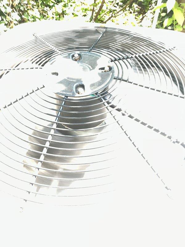 Completed comprehensive Gold AC inspection on 10+ year old air conditioning system with air handler located in basement. Performed thorough evaluation of outdoor condenser unit, inspecting fan assembly, blades, motor components, and housing condition. Verified proper operation of cooling system, examined condenser coil cleanliness, checked refrigerant levels, tested electrical connections, and assessed overall equipment performance. Noted condenser fan blades and housing in good condition with minimal debris accumulation. Advised customer to maintain clear area around outdoor unit, removing any debris and animal waste to ensure proper airflow and system efficiency. Documented equipment condition through photographic inspection showing clean fan assembly, secure mounting hardware, and well-maintained exterior components. System operational and functioning within normal parameters at time of inspection.