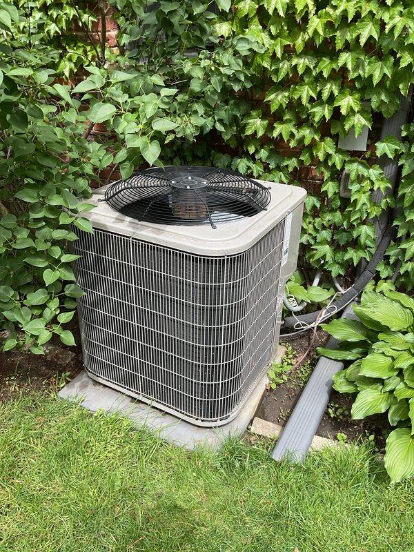 Performed comprehensive AC tune-up on 9-year-old residential system not producing cold air. Inspected outdoor condenser unit, verified refrigerant levels, cleaned coils, and tested system operation. System recharged to manufacturer specifications and confirmed proper cooling performance restored throughout home.