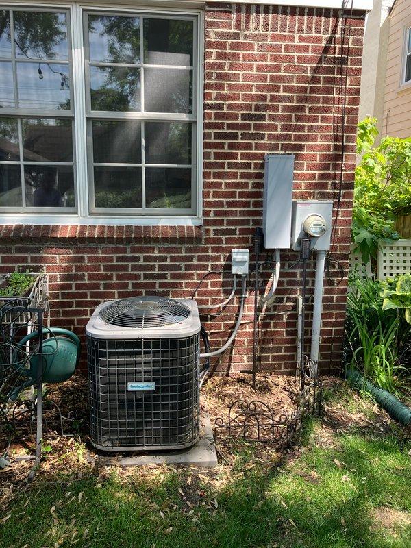 Completed estimate for replacement of 13-year-old residential air conditioning system experiencing no cooling condition with warm air discharge. System evaluation revealed failed outdoor fan motor and defective contactor on exterior AC unit positioned on concrete pad adjacent to brick structure. Indoor air handler and furnace located in basement utility area showed signs of age-related wear consistent with 10+ year-old equipment requiring full system replacement consideration.