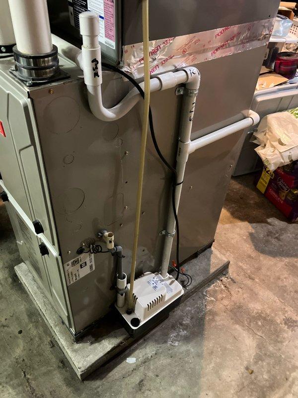 Completed estimate for replacement of 13-year-old residential air conditioning system experiencing no cooling condition with warm air discharge. System evaluation revealed failed outdoor fan motor and defective contactor on exterior AC unit positioned on concrete pad adjacent to brick structure. Indoor air handler and furnace located in basement utility area showed signs of age-related wear consistent with 10+ year-old equipment requiring full system replacement consideration.