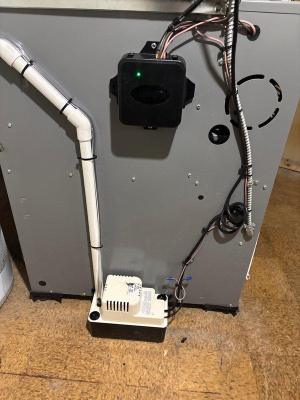 Completed installation of 2.5-ton air conditioning system with matching evaporator coil on right side of existing Arcoaire furnace in basement mechanical room. Installed new thermostat, condensate pump with PVC drain line, and performed electrical reconnection of all components. Mechanical, electrical, and air conditioning permits were requested and system was tested for proper operation upon completion.