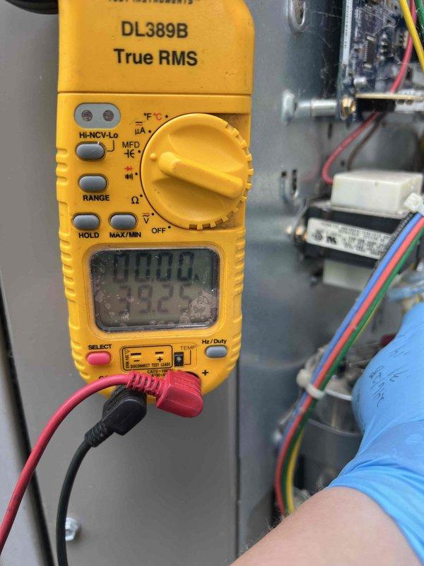 Completed comprehensive Gold AC Inspection on 10-year-old R-410A cooling system with basement air handler installation. Performed electrical diagnostics using digital multimeter to verify proper voltage and amperage at capacitor and control board connections. Measured system pressures and temperatures using calibrated gauges, recording low-side pressure at 105.6 psig with 34.2°F saturation temperature and high-side pressure at 286.8 psig with 92.8°F saturation temperature. Calculated superheat at 9.1°F (target 5.0°F) and subcooling at 16.7°F (target 14.0°F), indicating system is operating within acceptable parameters with slightly elevated superheat. System confirmed operational and cooling effectively at time of inspection.