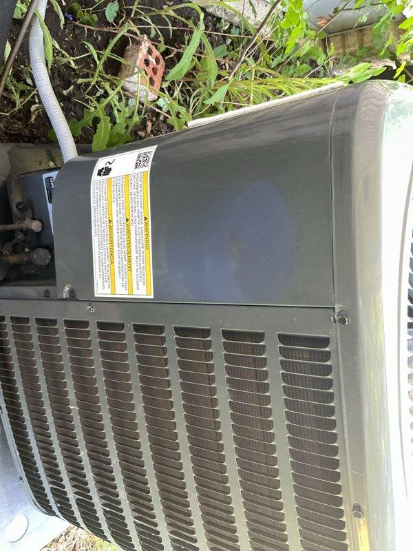 Completed comprehensive Gold AC inspection on residential air conditioning system with outdoor condenser unit and basement coil location. Performed thorough visual examination of exterior condenser unit, verified operational status of equipment, inspected electrical disconnect box and associated conduit connections mounted on exterior wall, and documented current condition of all accessible components. System found to be operational with no immediate service concerns identified during inspection.