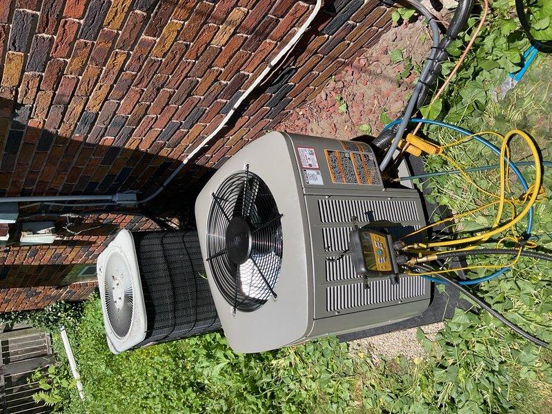 Completed a two-day installation of a 1.5-ton air conditioning system with evaporator coil at a residential property. The new outdoor condenser unit was positioned on a concrete pad against the brick exterior with proper refrigerant line connections, electrical conduit routing, and system flush performed. All mechanical, electrical, and air conditioning permits were obtained, and the unit was reconnected and tested for proper operation upon completion.