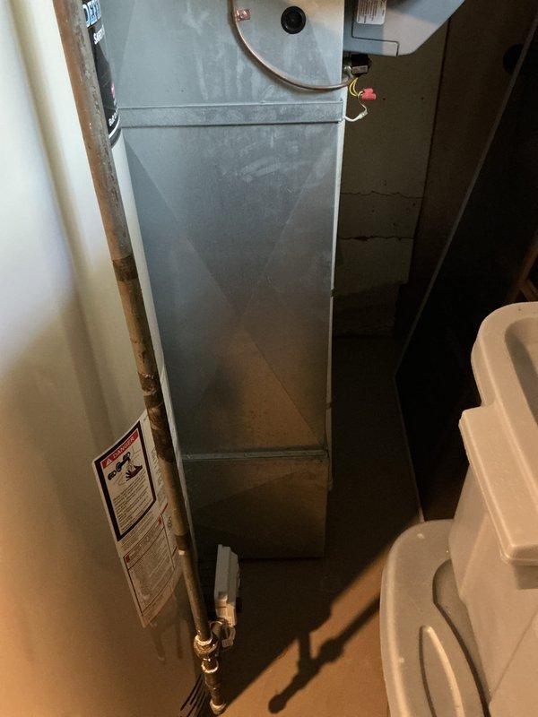 Provided comprehensive estimate for complete HVAC system replacement of 24-year-old air conditioning unit with basement-located evaporator coil. Assessed existing equipment configuration including air handler and associated components, documented current system condition through photographic inspection of thermostat controls and mechanical equipment layout, and prepared detailed replacement specifications for full system upgrade.
