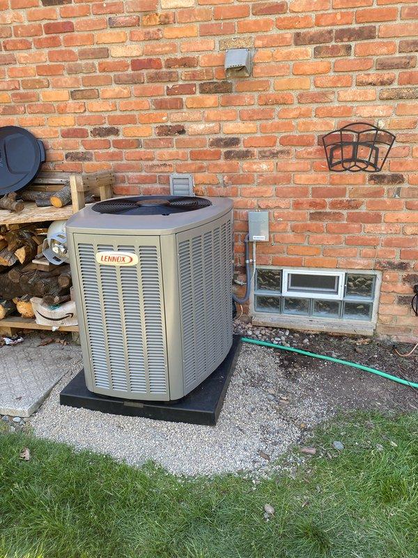 Completed installation of 3-ton Lennox air conditioning system with matching evaporator coil. Positioned outdoor condenser unit on rubber isolation pad against exterior brick wall with proper clearances, installed disconnect switch, and completed all electrical connections. Interior evaporator coil installed in mechanical room with furnace integration, condensate drain piping, and refrigerant line connections. System tested and operational, permit requested for mechanical and AC work.