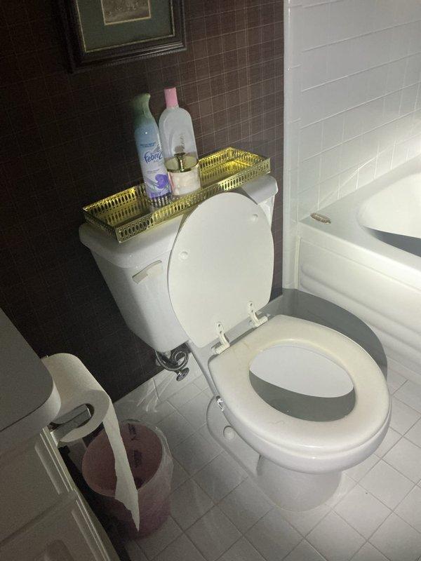 Responded to service call for handicap toilet installation quote at residential property. Conducted on-site assessment of existing bathroom configuration, which features standard height toilet with white subway tile and mosaic tile walls. Evaluated current fixture placement, clearance requirements, and accessibility needs for ADA-compliant toilet installation. Inspected basement plumbing infrastructure including main drain lines and water supply routing via sump pump area to determine feasibility of fixture replacement. Provided homeowner with detailed quote for removal of existing standard toilet and installation of ADA-compliant handicap-accessible toilet unit meeting required height specifications and grab bar mounting provisions.