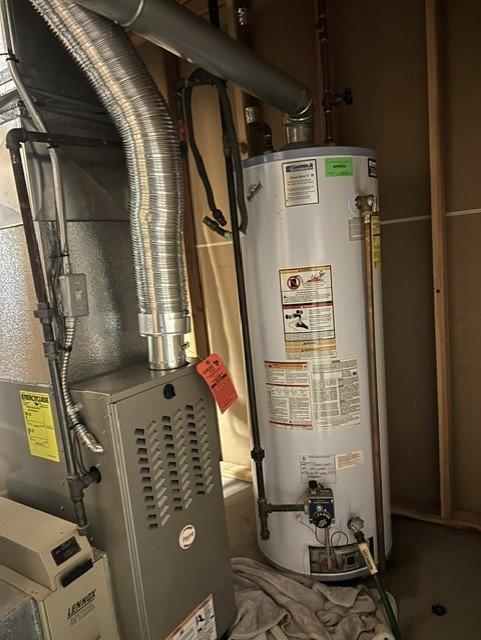 Replaced existing 50-gallon gas water heater with new 40-gallon standard gas unit in basement location. Removed old water heater, installed new unit with proper venting and gas line connections, verified all plumbing connections for leaks, and tested unit operation to ensure proper functionality. System is operating within manufacturer specifications with adequate hot water supply for household needs.