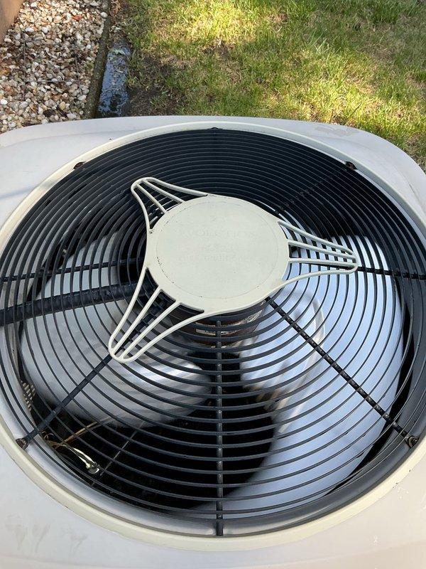Completed comprehensive Gold AC inspection on a 2-year-old residential air conditioning system. Performed visual inspection of outdoor condensing unit, confirming proper fan operation, clean coil surfaces, and secure wire guard assembly. Verified electrical disconnect box functionality and proper labeling. Inspected air handler and evaporator coil located in basement. All system components operating within normal parameters with no deficiencies noted at time of inspection.