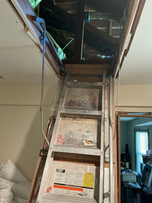 Completed comprehensive maintenance inspections on two 8-year-old air conditioning systems located in basement and attic. Evaluated air filter condition, verified proper airflow, and inspected accessible components including evaporator coils and system operation. Both units assessed for seasonal readiness with photographic documentation of filter media and attic access conditions.