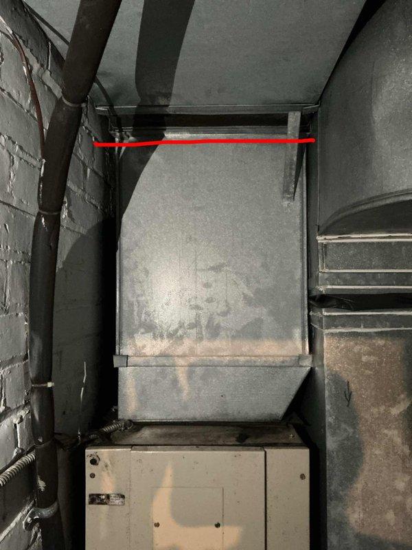Completed comprehensive evaluation of three aging R-22 air conditioning systems located in basement, kitchen, and attic areas. Systems originally installed in 1987, now over 10 years past recommended service life. Conducted thorough inspection of ductwork, noting visible corrosion, rust staining on metal components, and dust accumulation throughout mechanical spaces. Documented condition of galvanized sheet metal ductwork showing oxidation and weathering patterns consistent with aged equipment. Assessed accessibility constraints in confined mechanical spaces and evaluated structural support systems. Provided estimate for complete system replacement due to obsolete R-22 refrigerant and equipment age exceeding industry standards for reliable operation.