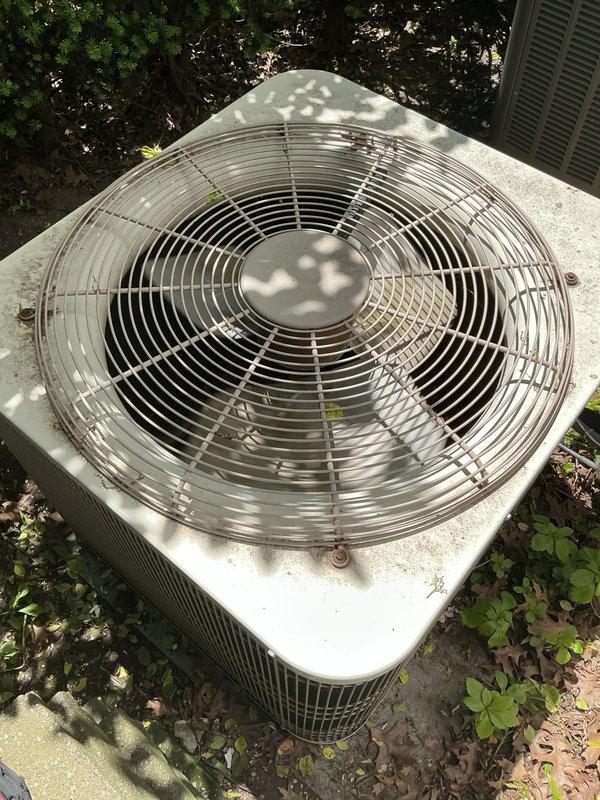 Completed Gold AC Inspection on a single residential air conditioning system less than 10 years old with air handler located in basement. Performed comprehensive maintenance inspection of outdoor condenser unit, which was found in operational condition with fan assembly functioning properly. Inspected condenser coils, fan motor, protective grille assembly, and electrical connections; noted unit shows normal weathering and surface accumulation consistent with outdoor installation. Verified system operational status and confirmed equipment is cooling effectively.