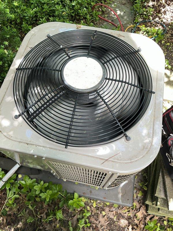 Completed Gold AC Inspection on a single residential air conditioning system less than 10 years old with air handler located in basement. Performed comprehensive maintenance inspection of outdoor condenser unit, which was found in operational condition with fan assembly functioning properly. Inspected condenser coils, fan motor, protective grille assembly, and electrical connections; noted unit shows normal weathering and surface accumulation consistent with outdoor installation. Verified system operational status and confirmed equipment is cooling effectively.