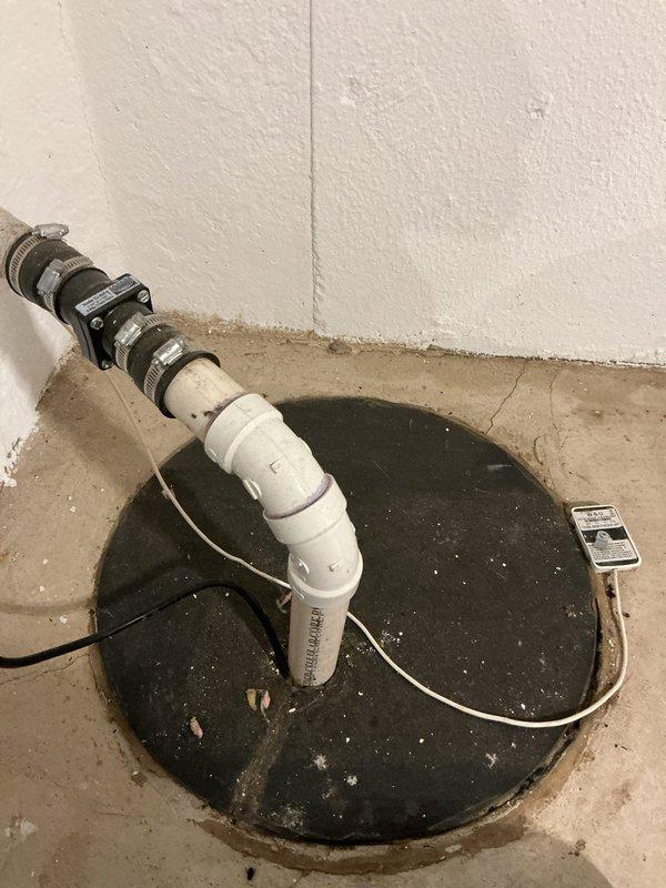 Reinstalled first-floor toilet, ensuring proper seating, wax ring seal, and water supply connection with verification of secure mounting and leak-free operation. Evaluated newly installed sump pump system, inspecting discharge piping, check valve installation, basin cover seal, and electrical connections to confirm proper functionality and code compliance.