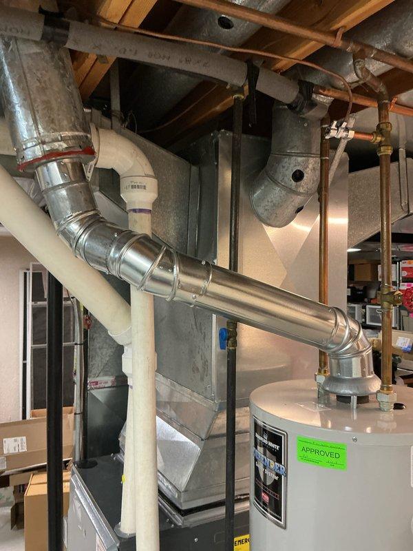 Provided estimate for tankless water heater replacement to address existing 15-year-old Bradford White Defender conventional tank water heater experiencing popping noise during operation. Evaluated current basement installation including gas supply line, copper piping connections, venting system, and clearance requirements for potential tankless conversion. Documented existing equipment configuration and utility connections to determine proper sizing and installation specifications for tankless unit replacement.