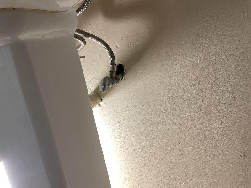 Responded to persistent "dancing pipes" noise complaint in 1967-built home, occurring between laundry room and half bath on main floor for four years despite previously installed water hammer arresters. Performed diagnostic assessment of plumbing system, identifying inadequate pipe strapping as the source of vibration and noise. Strategically removed minimal sections of drywall to access affected pipe runs, installed additional pipe strapping and support brackets to secure loose copper supply lines, and verified elimination of noise through multiple fixture operation tests.