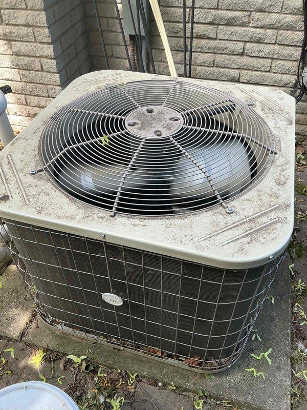 Completed comprehensive Gold AC inspection on 5-year-old Payne residential cooling system, Model PA13NA060-E, Serial 9521X68756, utilizing R-410A refrigerant. Inspected outdoor condenser unit located on concrete pad adjacent to building, noting operational fan assembly with protective grille intact, and basement-located air handler/coil. Unit confirmed operational with all components functioning within normal parameters; documented equipment specifications and current condition with photographic evidence.