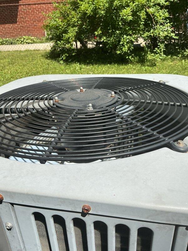 Completed comprehensive Gold AC inspection on 15-year-old residential air conditioning system with air handler located in basement and condenser unit positioned on exterior concrete pad. Performed multi-point inspection including examination of indoor air handler components, condensate drain pan showing signs of rust staining and mineral deposits, drainage lines, and outdoor condenser unit with visible corrosion on exterior fasteners. Verified system operational status, documented equipment condition through photographic records, and assessed overall performance of aging HVAC system under suitable weather conditions for accurate testing parameters.