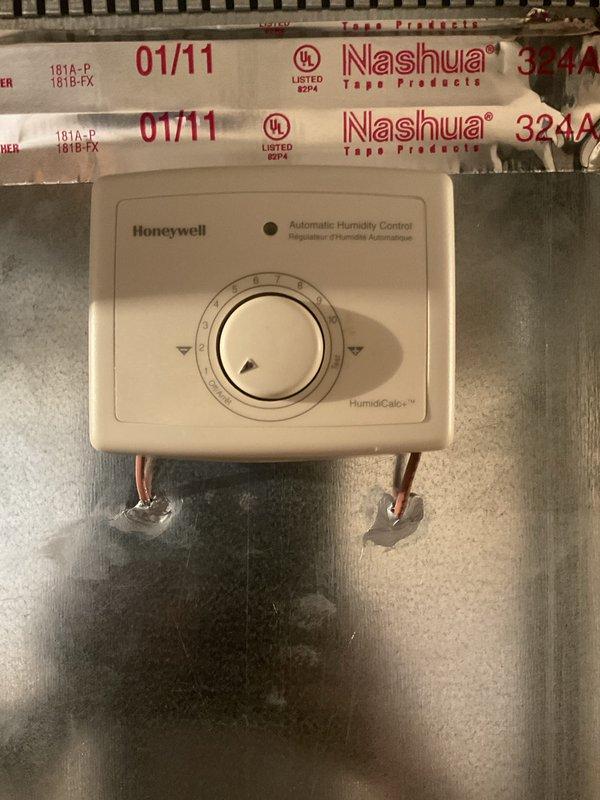 Completed comprehensive Gold AC inspection on 2-year-old residential cooling system with air handler located in basement. Verified proper operation of all equipment, inspected Honeywell automatic humidity control settings and connections, documented current system conditions including humidification components and Bradford White 30-gallon natural gas water heater specifications. All equipment found operating within normal parameters, and customer renewed Gold Plan maintenance agreement on-site.