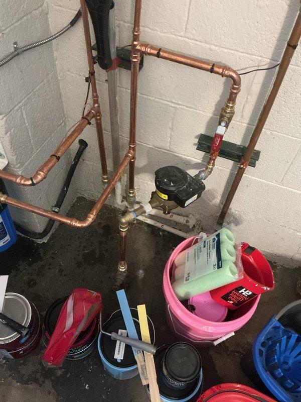 Conducted on-site assessment for replacement of galvanized steel piping located beneath the residence servicing the bathroom fixtures. Evaluated existing plumbing infrastructure including supply lines and drainage system. Inspected current copper piping installation with circulator pump and valve configuration mounted to foundation wall. Assessed bathroom plumbing connections including wall-mounted bidet spray system and floor-mounted toilet fixture. Provided comprehensive estimate for complete galvanized pipe replacement with modern piping materials and recommended quote for sewer drain line repair and upgrade to ensure proper functionality and code compliance.