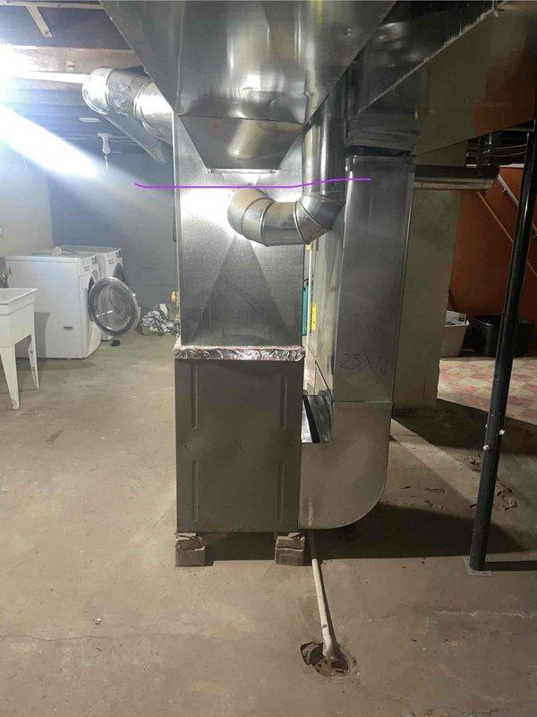 Conducted on-site assessment of basement-located HVAC system to provide replacement estimate for air conditioning unit. Evaluated existing furnace, air handler, and ductwork configuration in mechanical room, noting natural gas fuel source and current system layout with overhead plenum and distribution ductwork. Documented equipment specifications and installation requirements for comprehensive AC replacement proposal.