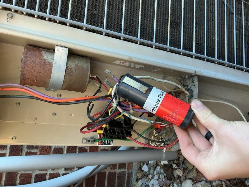Completed comprehensive Gold AC inspection on a two-unit residential HVAC system with air handler located in attic. Performed detailed electrical diagnostics on outdoor condensing unit, measuring amperage draw at 31.9 amps using clamp meter to verify compressor performance within manufacturer specifications. Inspected capacitor, contactor, and all electrical connections for signs of wear, corrosion, and proper operation. Evaluated condenser coil condition, airflow through louvers, and overall system functionality. All components found operating normally with equipment responding appropriately to cooling demand. System confirmed in good working order at time of inspection.