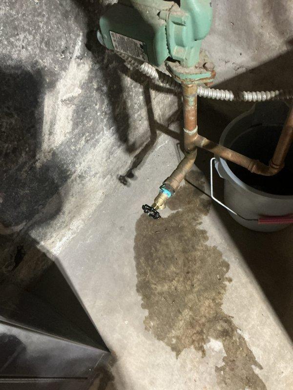 Delivered replacement radiator to property and conducted inspection of hydronic heating system. Identified defective radiator unit requiring swap or repair and discovered leaking threads on secondary unit requiring re-tapping with 1.25" tap. Assessed aging boiler system and recommended installation of 1" press ball valve near boiler to facilitate zone bleeding operations and replacement of deteriorated 3/4" boiler drain. Customer will contact manufacturer customer service regarding warranty coverage before scheduling return visit to complete repairs. Documented existing conditions including corroded copper piping, aging circulation pump with visible oxidation, and moisture staining near valve assembly. Awaiting customer confirmation to proceed with unit replacement, thread repair, and recommended system upgrades.