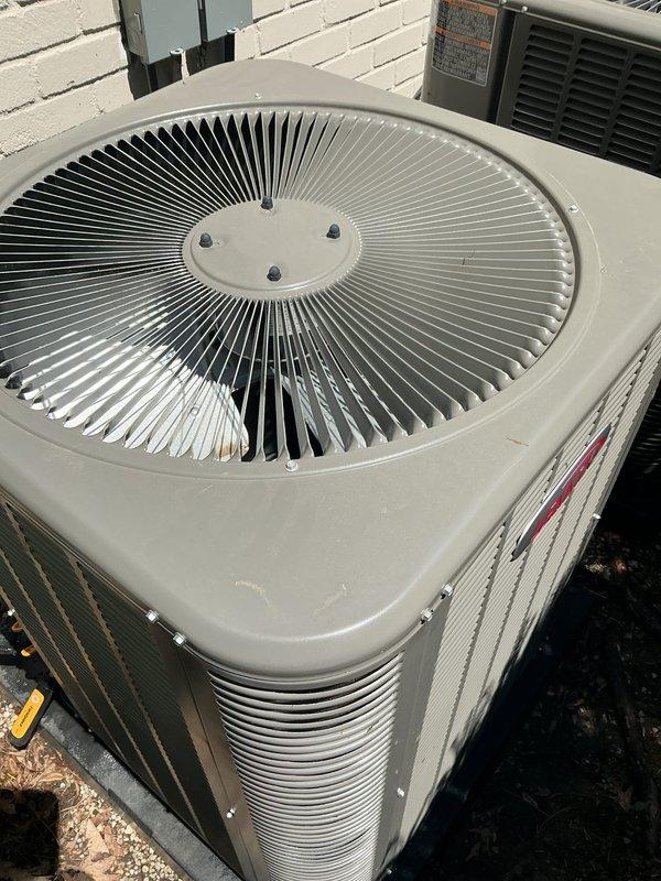 Completed comprehensive Gold AC inspection on a multi-unit residential system with equipment over 10 years old. Inspected outdoor condenser unit with beige housing, verified proper fan operation and structural integrity, confirmed unit was free of debris and showed normal weathering with no significant damage or deterioration. Basement air handler/coil location inspected and documented, system operational and functioning as designed at time of service.