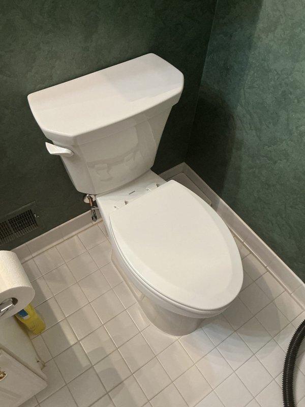 Completed installation of two new white porcelain two-piece toilets in separate bathroom locations per approved estimate. Both fixtures were properly positioned, secured, and connected to existing water supply lines with chrome shut-off valves. All wax ring seals were installed, mounting bolts tightened to specification, and water connections tested for proper operation and leak-free performance.