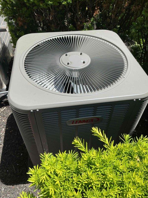 # HVAC Maintenance - Gold AC Inspection

Performed comprehensive spring maintenance on a 2-year-old Lennox air conditioning system at a residential property. The outdoor condenser unit, positioned on a concrete pad in the side yard, was in excellent operational condition with clean exterior surfaces and proper clearances maintained around the unit.

## Inspection and Testing Procedures

Conducted thorough visual inspection of the condenser unit, confirming all exterior panels, louvers, and top grille assembly were intact and secure. Verified proper mounting of center fan cap with all fasteners tight. Inspected the concrete pad for levelness and stability with no settling or deterioration noted.

Examined refrigerant line set and PVC condensate drain piping routed along the brick exterior wall. All piping connections were secure with no signs of leakage, damage, or UV deterioration. Electrical disconnect box mounted on exterior wall was inspected and found in proper working order.

## M